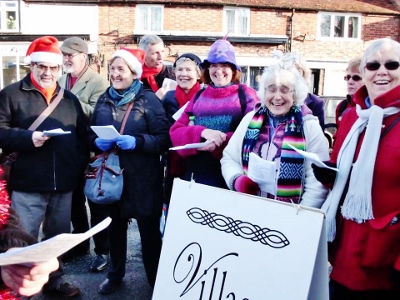 Village Voices singing in Thame town centre at Christmas