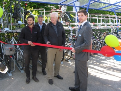 L to R - Misha Lund (Project Officer, Sustrans); Mike Barber (Travel Advisor, Sustrans); Roderick Floud of Haddenham Safe Walking & Cycling Group prepares to cut the ribbon to open the new cycle park; Mark Pateman (Regional Manager, Chiltern Railways)