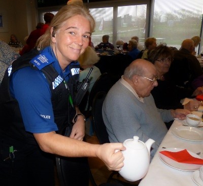 PCSO Diane Jackson serves tea to Thame's senior citizens